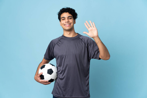 Venezuelan football player man over isolated background counting five with fingers - Photo, Image