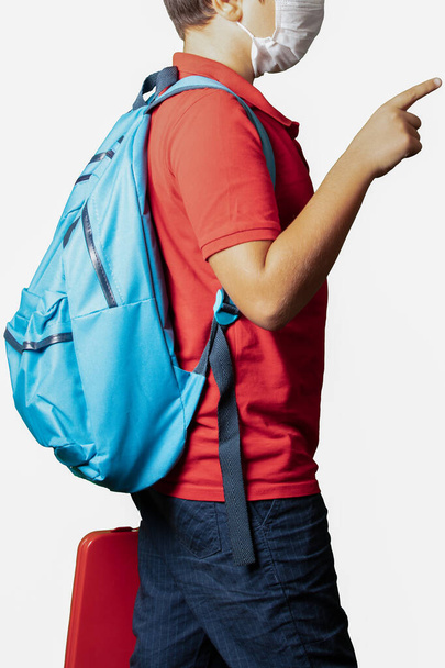 kid boy wearing backpack standing over isolated white background - Foto, Imagen