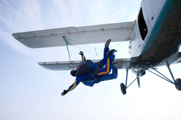 SKydiving. A tandem has just jumped out of a white airplane. - Photo, Image