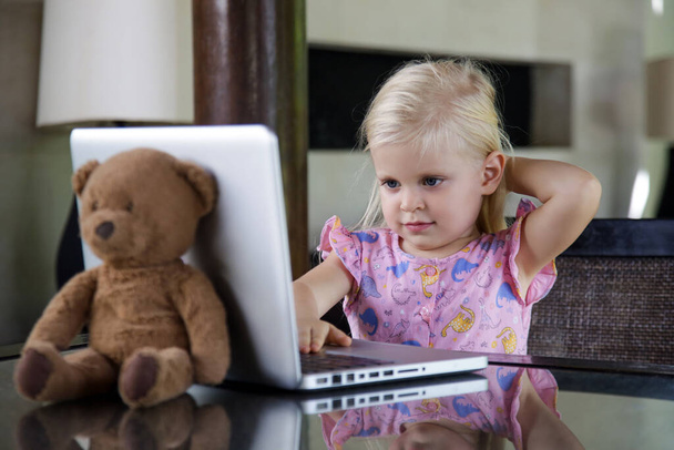 Happy 3 years old girl in front of laptop - Photo, Image