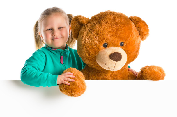 little girl with big teddy bear - Фото, зображення