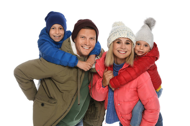 Happy family with children in warm clothes on white background. Winter season - Fotoğraf, Görsel