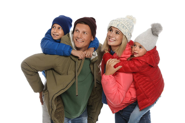 Happy family with children in warm clothes on white background. Winter season - Fotografie, Obrázek