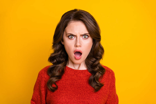 Closeup photo of attractive curly shocked lady open mouth listen bad news quarantine corona virus continue wear red knitted sweater isolated yellow color background - Fotoğraf, Görsel