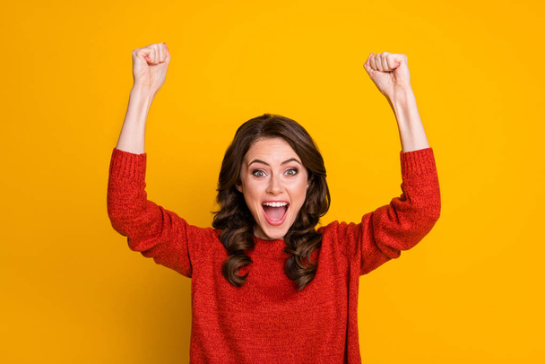 Photo of pretty girl raising up hands screaming yeah isolated over yellow background - Photo, Image