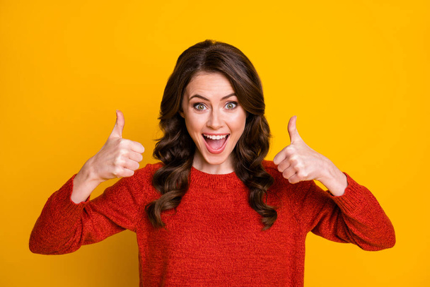 Close-up portrait of her she nice attractive lovely pretty ecstatic lucky cheerful cheery wavy-haired girl showing thumbup advert isolated over bright vivid shine vibrant yellow color background - Foto, Imagen