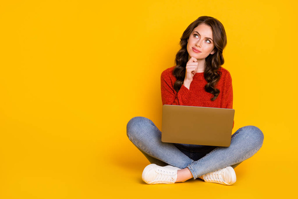 Portrait of her she nice attractive lovely curious cheery wavy-haired girl sitting using laptop creating it start-up project isolated on bright vivid shine vibrant yellow color background - Foto, Imagen