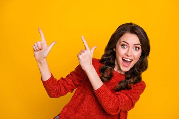 Close-up portrait of her she nice-looking attractive lovely cheerful cheery glad wavy-haired girl pointing forefingers up ad advert decision isolated bright vivid shine vibrant yellow color background - 写真・画像