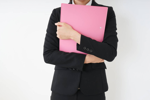 Young woman having some documents at office  - Photo, image