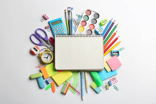 Blank notebook and school stationery on white background, flat lay with space for text. Back to school - Photo, image