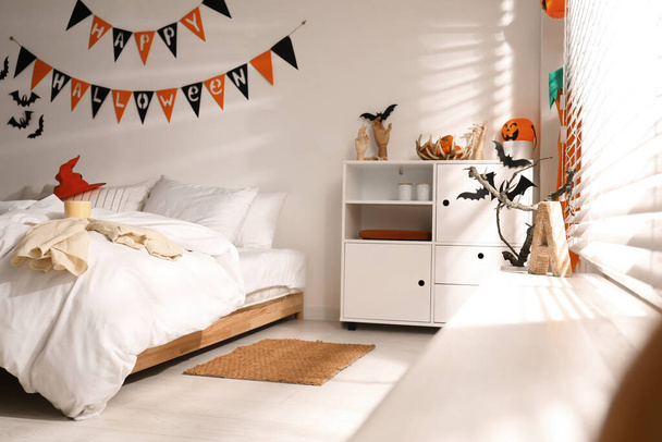 Stylish bedroom interior with festive Halloween decor - Fotoğraf, Görsel
