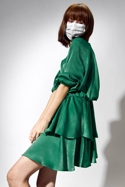  Fashion female coronavirus, model posing with gloves and protective medical mask - Фото, изображение