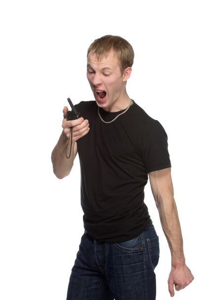 Young security officer talking through his walkie talkie. - Fotó, kép