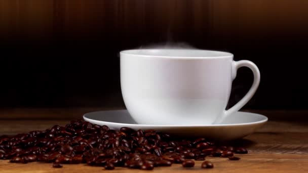 Freshly brewed coffee cup with coffee beans. - Footage, Video