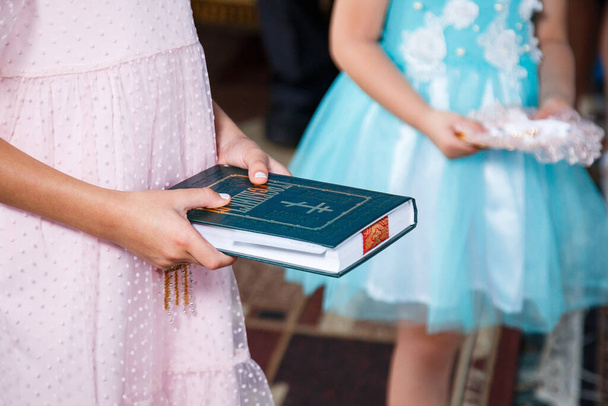 Orthodox religion. Girl hands on the bible. - Photo, image