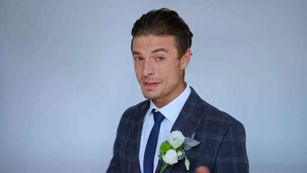 happy groom looking at camera and talking isolated on grey - Footage, Video