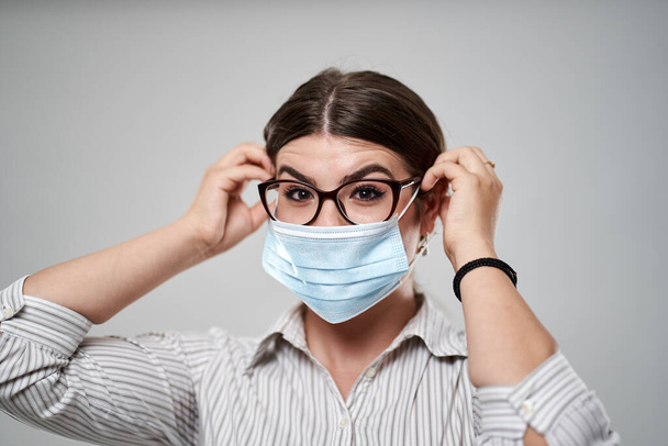Businesswoman with protective face mask against covid-19 coronavirus - 写真・画像