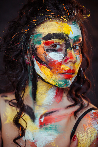 paint on the face of a young girl - Fotó, kép