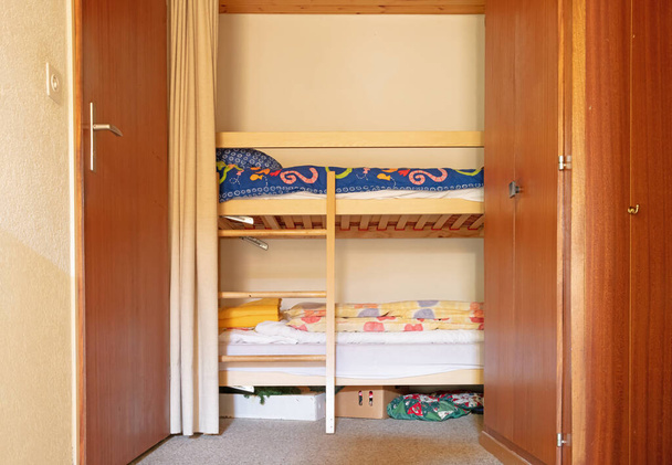 Bunk bed in the hallway of an old apartment, selective focus - Фото, зображення