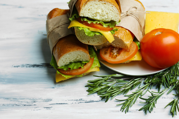 Fresh and tasty sandwich on wooden background - Photo, Image