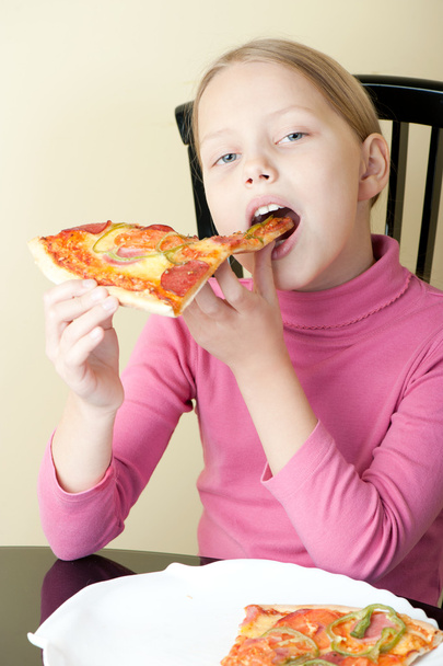 Cheerful little girl with pizza - Foto, Bild