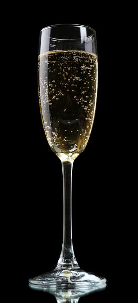 Glass of champagne, on black background - Foto, afbeelding