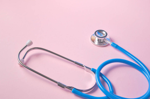 blue stethoscope on pink background. For check heart or health check up concept - Foto, Imagem