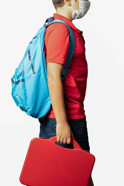 kid boy wearing backpack standing over isolated white background - Foto, Imagen
