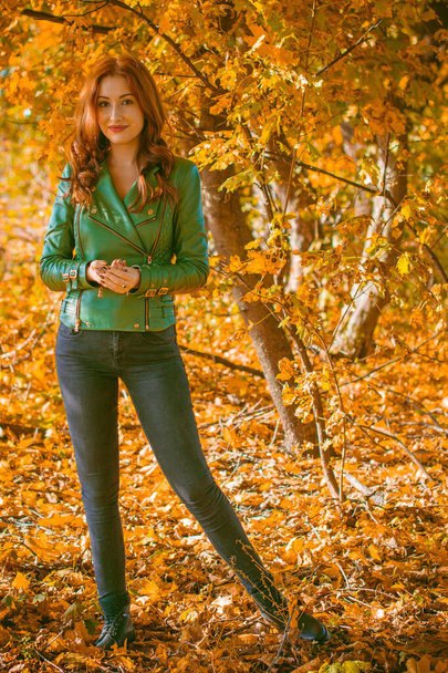 Fall, nature and people concept - Young beautiful woman with red hair have a rest in autumn time. Pretty nice woman traveler is relax. Enjoying mountains, concept adventure active vacations outdoor - Fotografie, Obrázek