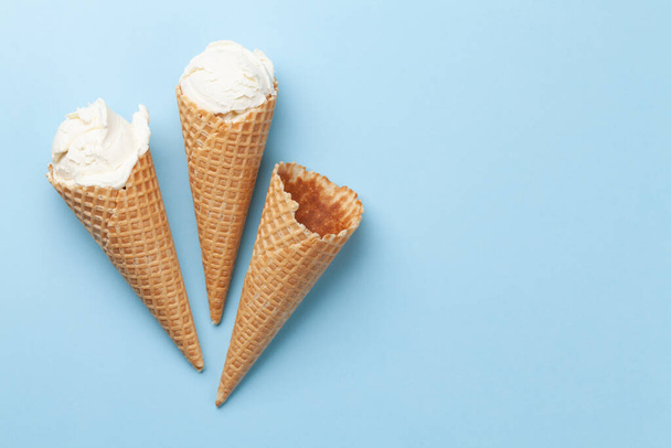 Homemade vanilla ice cream sundae and waffle cones. Top view flat lay with copy space - Photo, Image