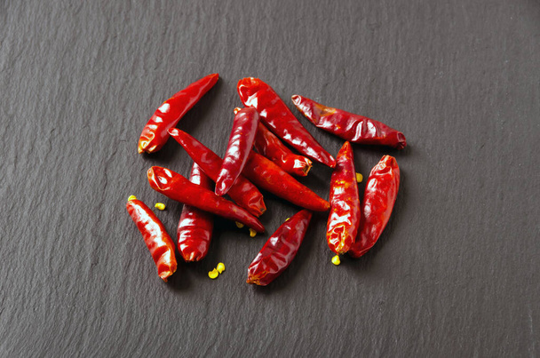 Takanotsume,  Red Hot Pepper on black stone plate - Photo, Image