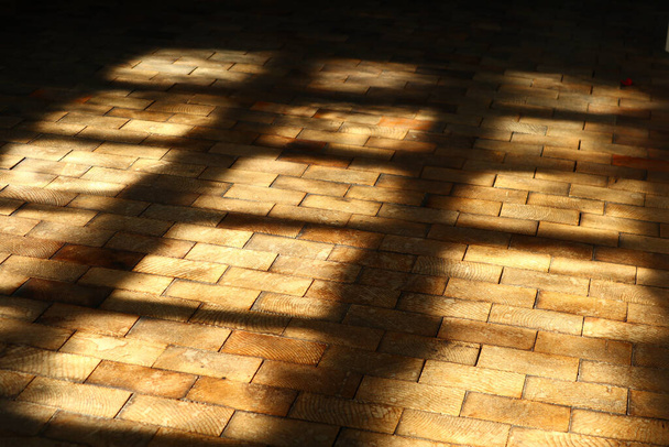 An old wooden floor with a shadow of a window - Foto, Imagem