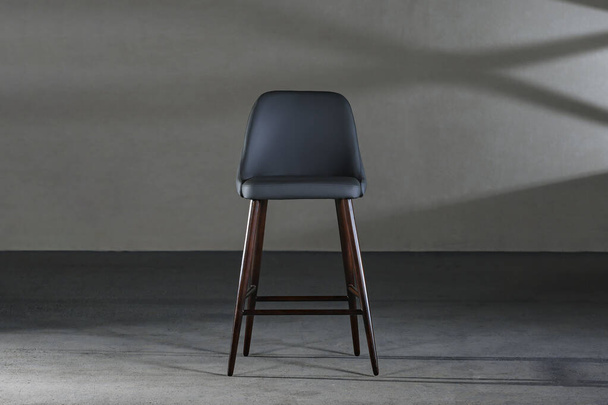 A closeup of an armless chair with a concave back, loft-style furniture - Foto, Imagem