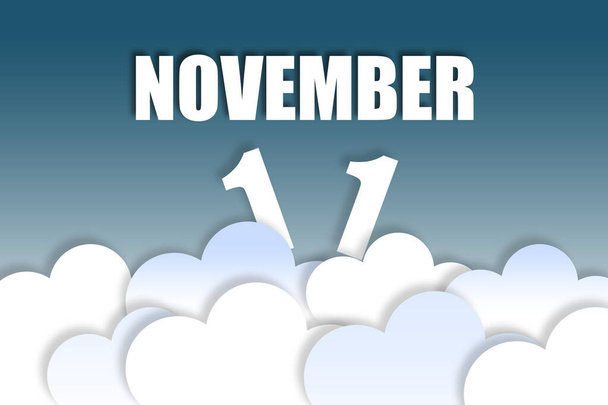november 11th. Day 11 of month, Month name and date floating in the air on beautiful blue sky background with fluffy clouds. autumn month, day of the year concept. - Photo, Image