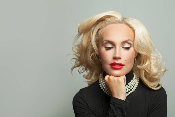 Beautiful woman with blowing blonde hair - Fotografie, Obrázek