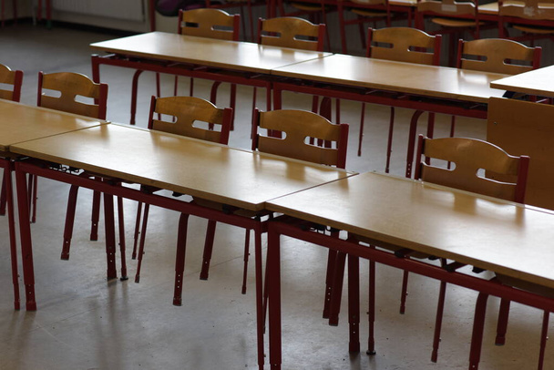 An empty children classroom with chairs and tables - Photo, Image