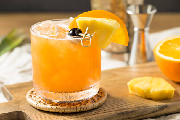 Refreshing Boozy Rum Runner Cocktail with PIneapple and Orange - Fotó, kép