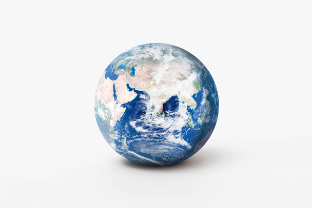 World environment day concept. Earth globe model with shadow on white background. Elements of this image furnished by NASA - Φωτογραφία, εικόνα
