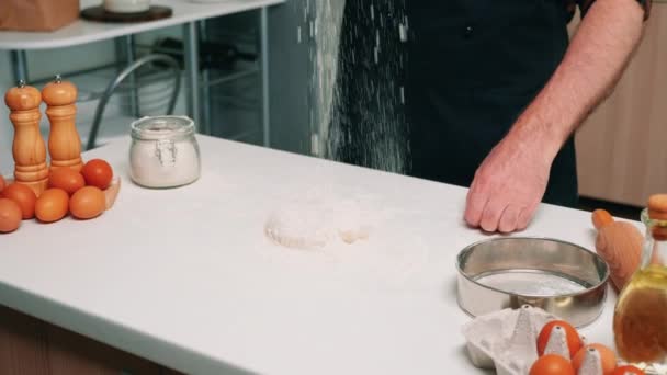 Sifting flour on dough for baking - Footage, Video