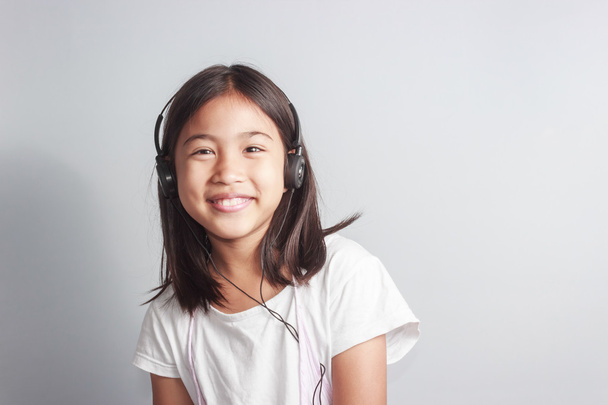 little girl with headphone - Foto, Imagem