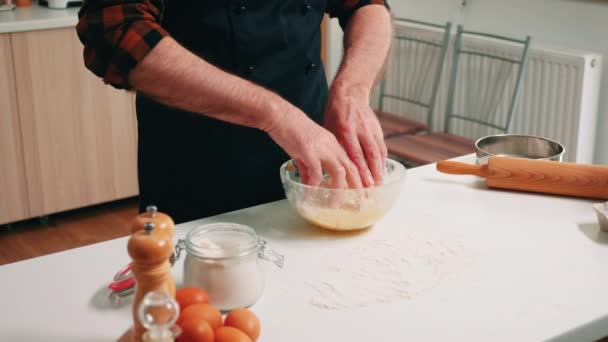 Kneading bread dough in a glass bowl - Záběry, video