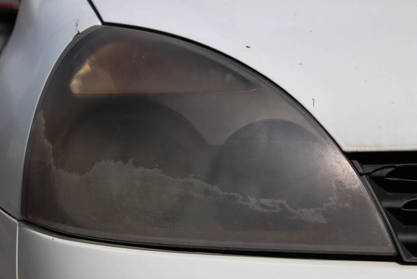 Close-up of dusty headlight. - Photo, Image