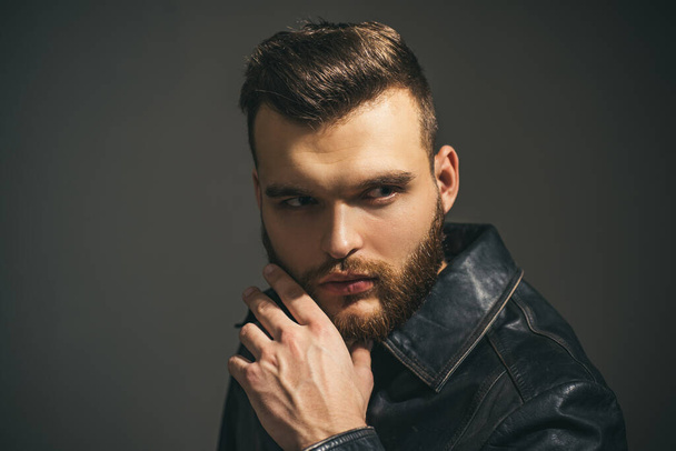 Handsome confident man. Serious guy posing in studio. Stylish haircut, hairstyle. Hair style. - Fotoğraf, Görsel