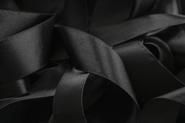 Black silk ribbon as background, abstract and luxury brand design, Stock  image