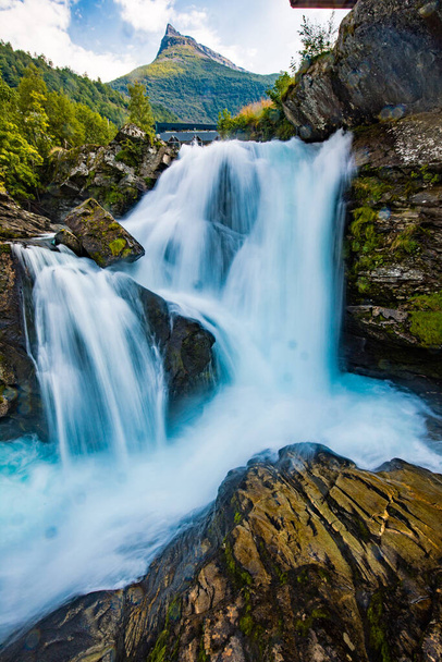 Panoramic iew of the river Geirangerelvi and the waterfall Storfossen in Geiranger, Norway. - 写真・画像