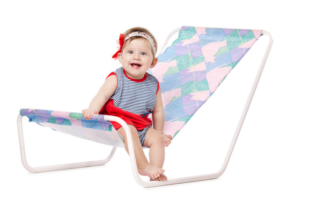 baby lying on lounger isolated on white - Foto, Imagen