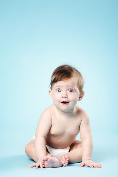 happy baby on blue background - Foto, Imagem