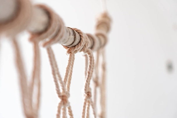 Sea-worn bamboo cane used for macrame curtain, light colors and white - Photo, Image