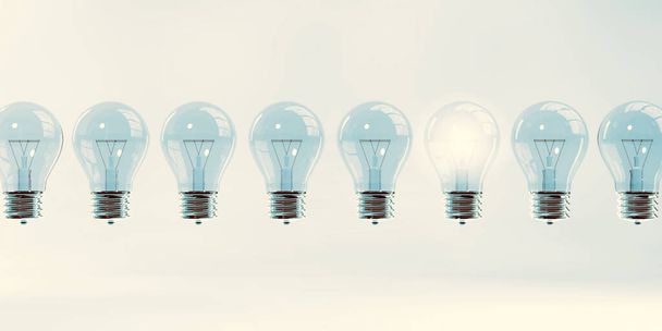Glowing Light Bulb as a Business Idea Concept - Foto, afbeelding