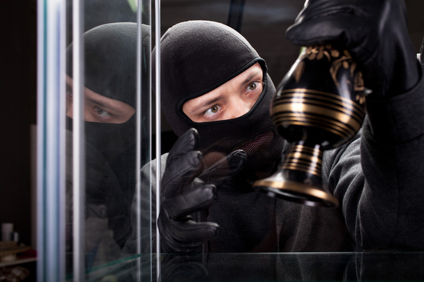 Burglar wearing black mask - Foto, afbeelding